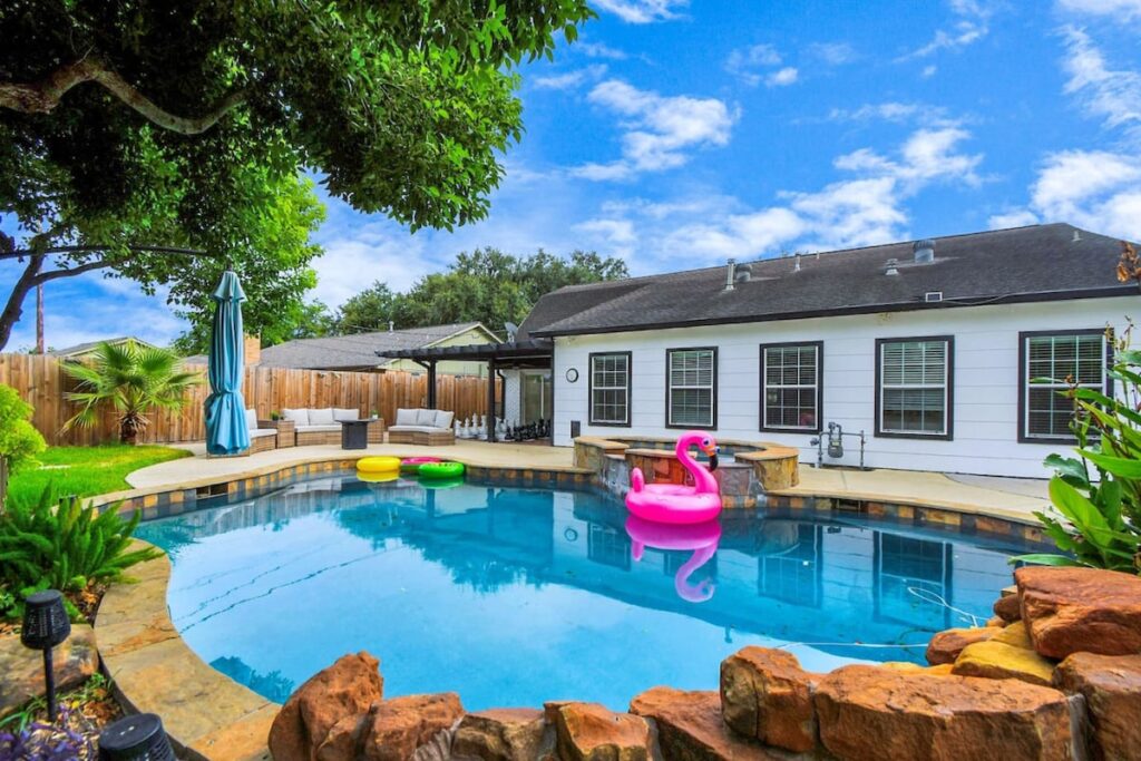 Top 6 Vacation Homes in Houston – Curated by Levi Homes Superhosts 2 new floral haven heated pool game room 9